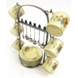 1920s floral pottery six piece coffee set on a silver plated stand with matching coffeebean