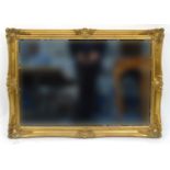 Ornate gilt framed bevel edged mirror, 105cm x 74cm : For Condition Reports Please visit www.