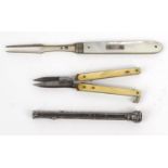 Victorian silver bladed pocket fork, silver propelling pencil and a folding pair of scissors, the