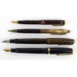 Two Parker striped fountain pens ,two Parker striped ballpoint pens and an Eversharp example, the