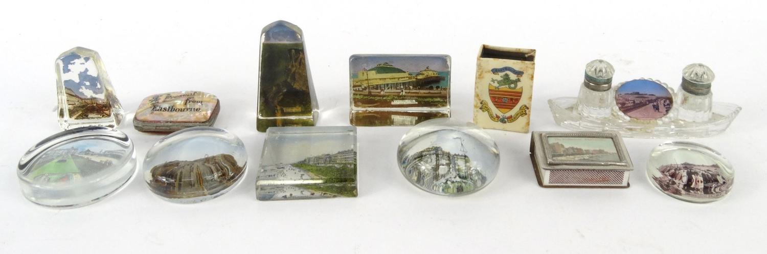 Selection of souvenir glass paperweights from Eastbourne, purse, matchbox holders and a glass ink