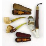 Selection of smoking interest pipes including boxed Cossack example, the largest 25cm long :For