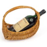 Bottle of vintage port W. & J. Graham & Co, Oporto, Finest Reserve 1970, housed in a wicker carrying