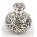 Globular silver scent bottle with embossed decoration, indistinct Birmingham hallmark, 5.5cm high :