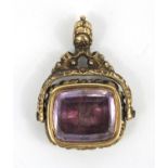 Victorian gilt metal amethyst seal spinner fob, 3.5cm high