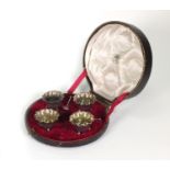 Cased set of four silver salts and three spoons by Goldsmiths & Silversmiths Company, London 1916,