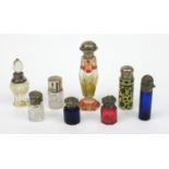 Selection of silver topped cut glass scent bottles including Bristol Blue examples and a floral