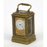 Miniature brass carriage clock, with floral and enamel dial, the movement stamped 01885, 7cm high