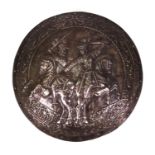 Metal shield decorated with knights on horseback, 40cms diameter