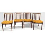 Set of four vintage teak dining chairs with upholstered seats