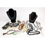 Large selection of vintage costume jewellery necklaces including polished stones, assorted beads,