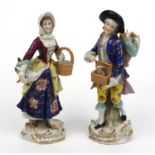 Pair of Continental porcelain figures of a shepherd and a shepherdess, each 20cm high