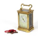 Brass carriage clock with enamel dial, 11cm high excluding the handle