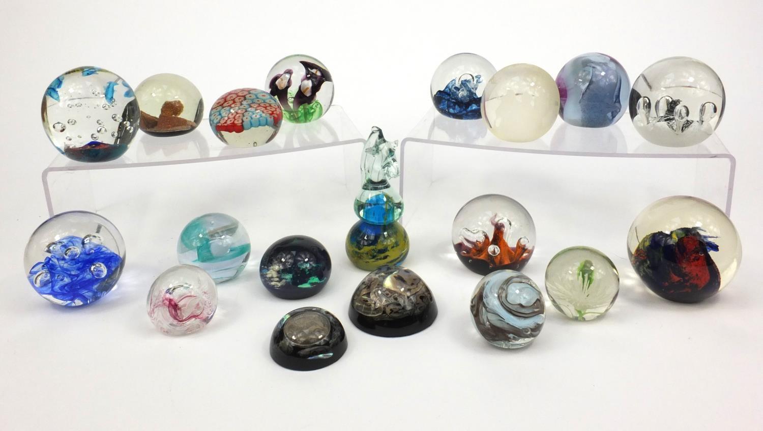 Group of colourful glass paperweights including Langham, Mdina and Caithness examples