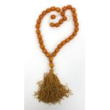 Amber coloured bead necklace, 60cm long, approximate weight 66.0g