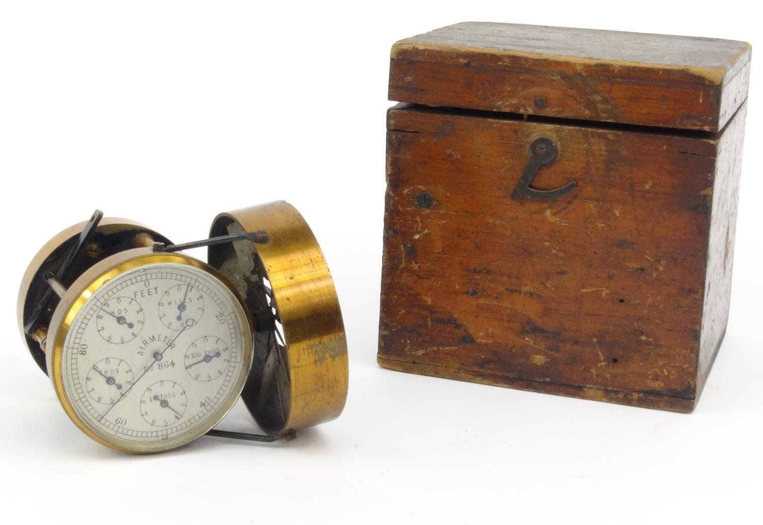 Brass air meter with silvered dial in original wooden carrying box, number 864, 9cm high