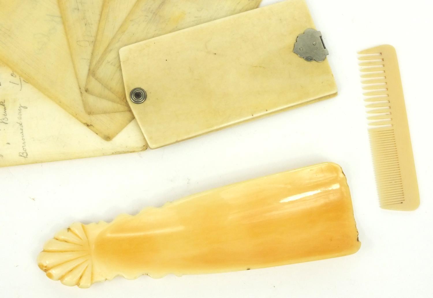 Ivory aide de memoire, ivory shoe horn and a child's comb, the largest 12cm long - Image 2 of 4