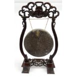 Oriental Chinese hardwood and bronze dinner gong carved with mythical beasts, 86cm high