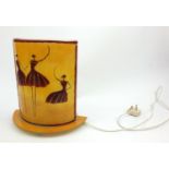 Art Deco style curved desk light decorated with three figures, 30cm high