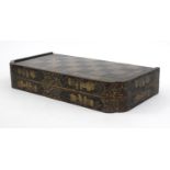 Oriental Chinese black lacquered folding games board with chinoiserie decoration, 49cm wide (when