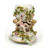 Continental porcelain centrepiece hand painted and moulded with cherubs and flowers, 29cm high The