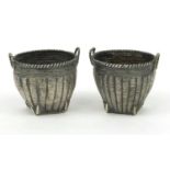 Pair of oriental Chinese silver basket shaped salts, character marks and HC to the base, 3.5cm high