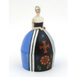 Carltonware crinoline lady powder pot and cover hand painted with an abstract pattern, 14cm tall