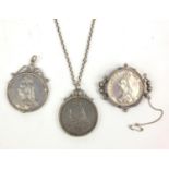 Three mounted Victorian silver coins - two crowns - 1889 and 1891, together with an 1887 double