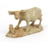 Oriental Chinese hardstone carving of a water buffalo, character mark to base, 17cm diameter