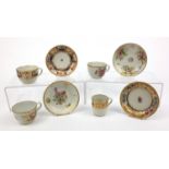 Four Newhall porcelain cups and saucers - one painted with a landscape scene, the remainder