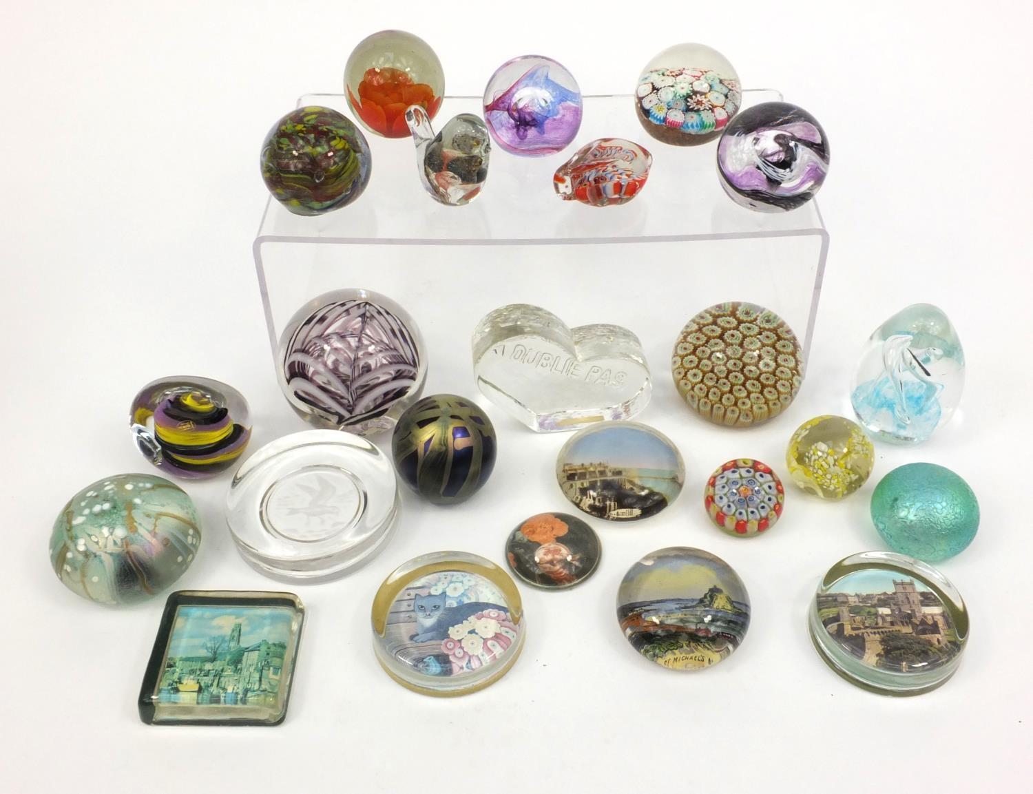 Collection of colourful glass paperweights including Caithness, Isle of Wight and Liskeard glass