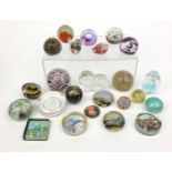 Collection of colourful glass paperweights including Caithness, Isle of Wight and Liskeard glass