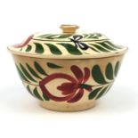 Large Llanelly style pottery bowl and cover hand painted with stylised roses, 25cm diameter