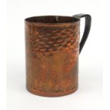 Arts and Crafts style copper tankard decorated with a stylised panel of sheep under trees, 14cm high