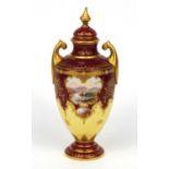 Coalport porcelain urn and cover hand painted with a castle and loch scene, 23cm diameter The knop