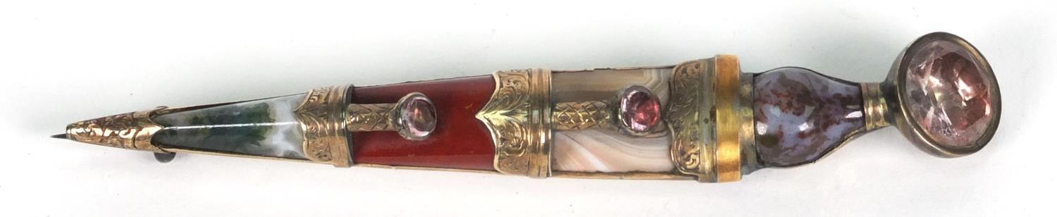 Scottish silver gilt dirk brooch set with hard stones including agate and pink stones, 9.5cm long,