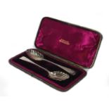 Cased pair of Georgian silver berry spoons, SA London 1800, housed in a W. Batty & Son box, 22cm