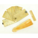 Ivory aide de memoire, ivory shoe horn and a child's comb, the largest 12cm long