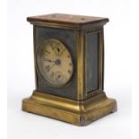 Brass cased musical mantel clock decorated with swags, 15cm high