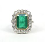 Unmarked white gold emerald and diamond ring, size N, approximate weight 7.5g The emerald is