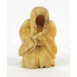 Oriental Netsuke of a figure, signed to the base, 5.5cm high