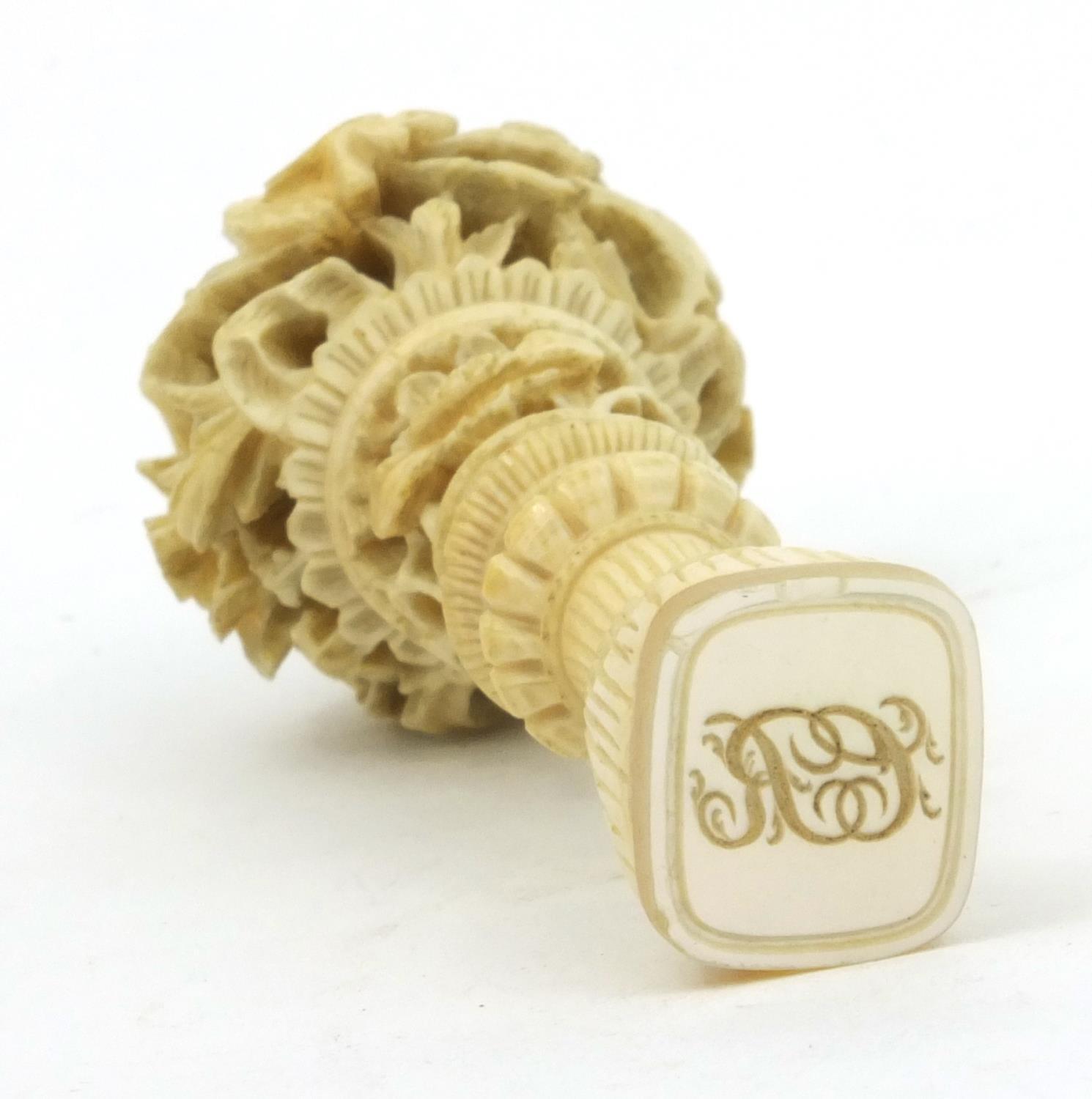 Oriental Chinese ivory and mother of pearl seal with carved floral decoration, 7cm long Generally