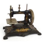 Victorian cast iron sewing machine with gilt Art Nouveau floral design, 28cm diameter