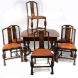 1930s oak drawleaf dining table and six chairs with brown leather drop in seats, the table 76cm high