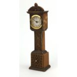 Miniature grandfather clock with brass mounts, the dial with initials ESU, 30cm high