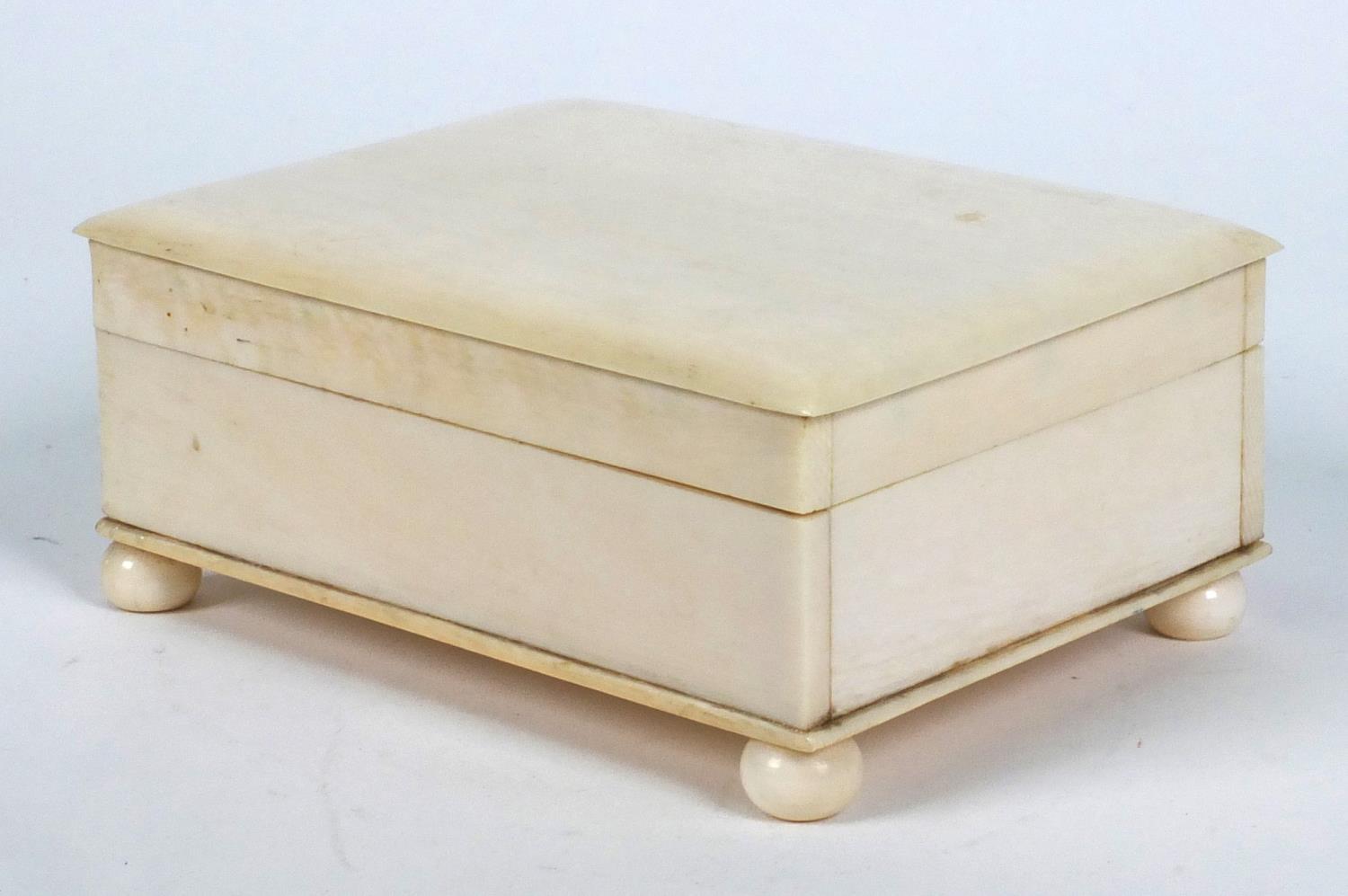 Ivory box on bun shaped feet, 12cm x 9cm