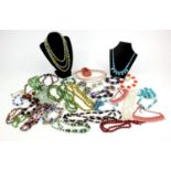 Large selection of vintage costume jewellery necklaces including polished stones, glass beads, etc