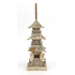 Oriental Chinese ivory pagoda with doors revealing a miniature Buddha decorated with birds and