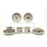 Three Newhall cups and saucers hand painted with floral decoration and a tea bowl and saucer, the