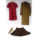 Three items of vintage Biba clothing comprising brown skirt with black and gold label, pink dress